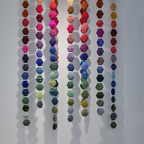 Fiber Mobile. Hanging Sculpture 2016 - 2019. 7’ x 5’ x 1’ 5”. 150 “hexapuffs” hand knit with merino yarn hanging from copper wire.