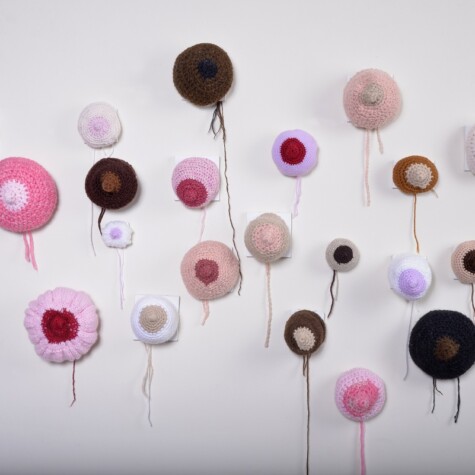 "BFF-Breast Friends Forever" 2015. 5' x 3' x 3" approx. Honoring women of all colors, whose lives have been affected by breast cancer and who share these BFF. Knit and crochet yarn sculptures mounted on individual canvases (2"-3" each)