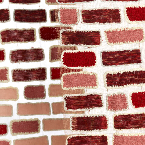 “Walking through brick walls.” 2019. 3 panels, 7’ x 30” each. Yarn bricks sewn onto copper wire knit mesh.
