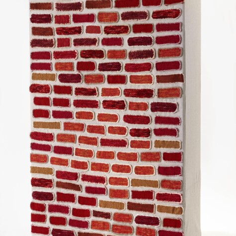 "Brick By Brick" 2018. Aims to challenge the boundaries imposed between fellow humans. 6' 3" x 4' x 1" 6". Hand knit and crocheted bricks applied over linen fabric.