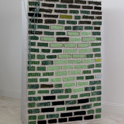 "Fiber Wall. A Ray of Light” 2019. 6’ 3” x 4’ x 1’ 6”. Hand knit bricks applied on linen fabric.