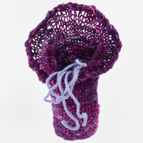 Hand knit artwork with wool yarn.